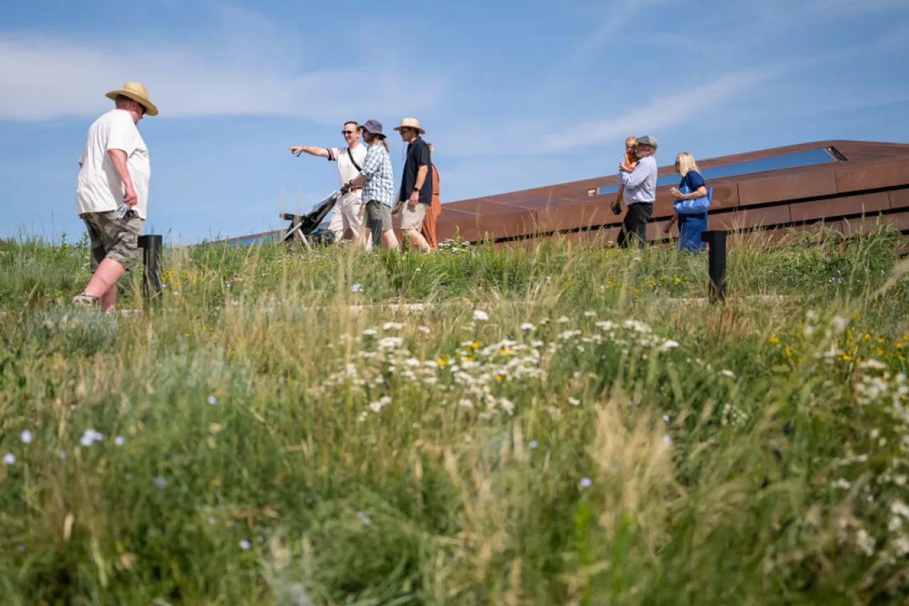 Visitors walking the grass-covered roof of the Theodore Roosevelt Presidential Library in Medora, North Dakota