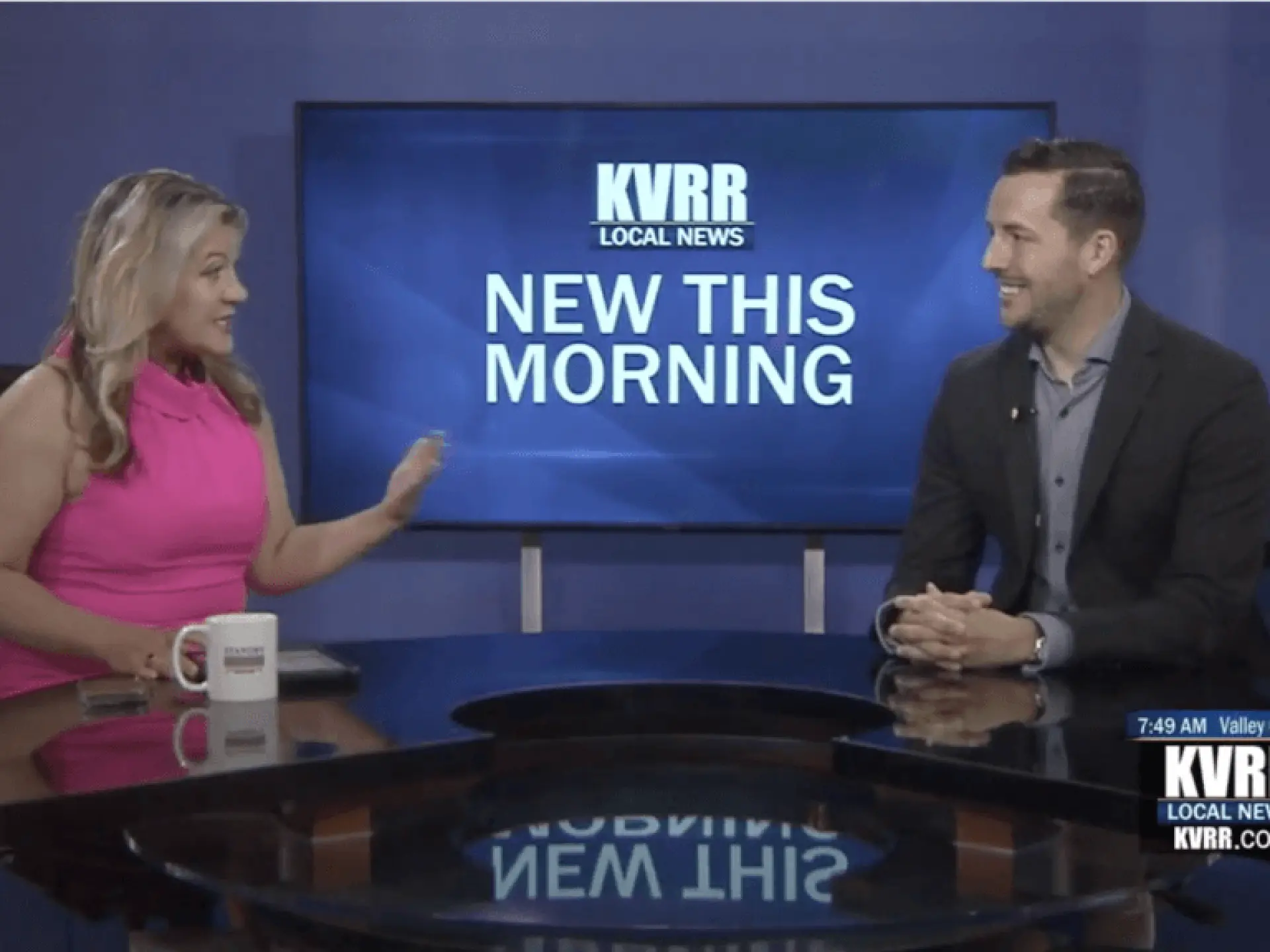 TV hosts talking at a news desk with "New This Morning" on the screen behind them.