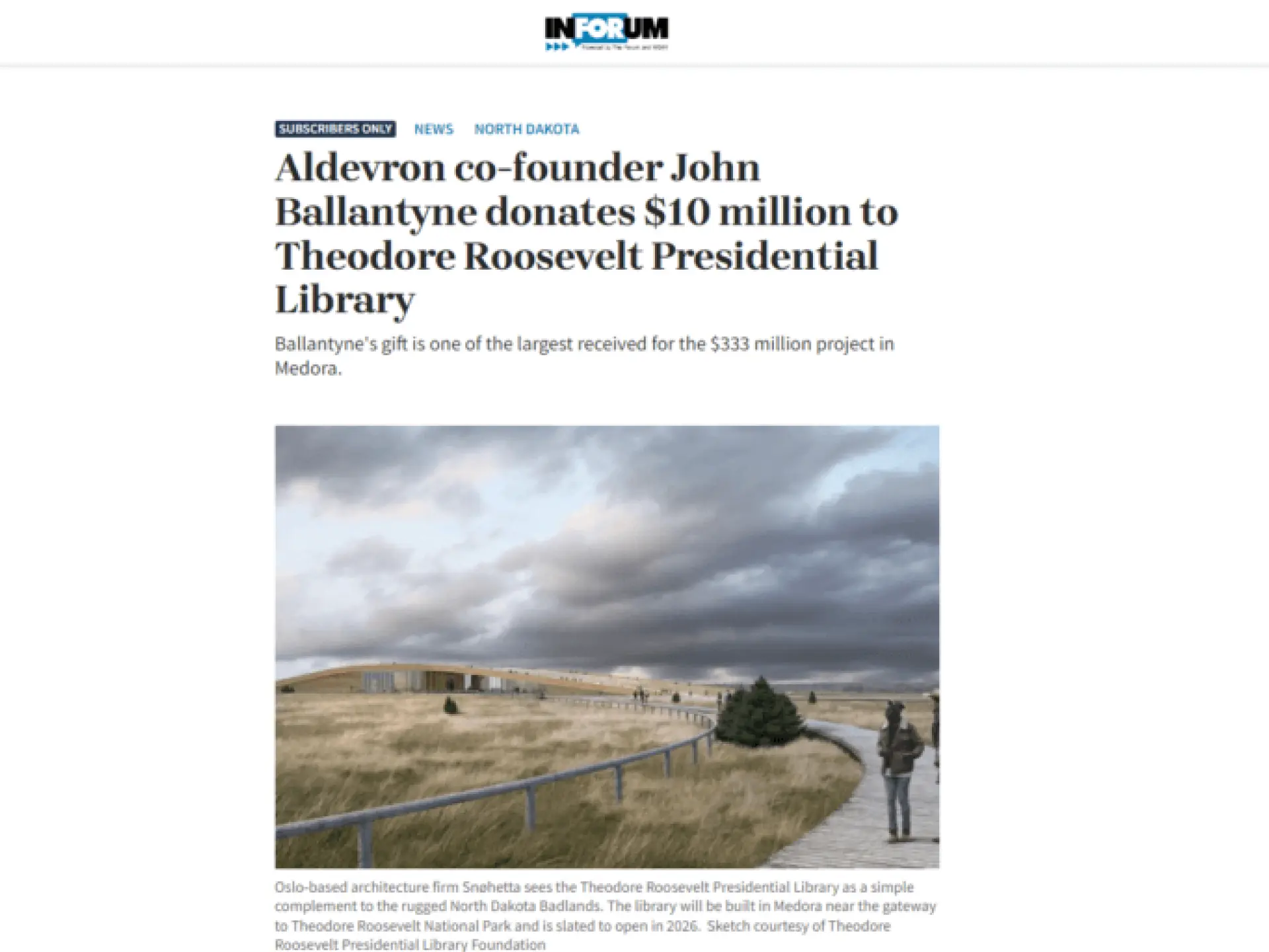 A path winds through a grassy field under a cloudy sky.