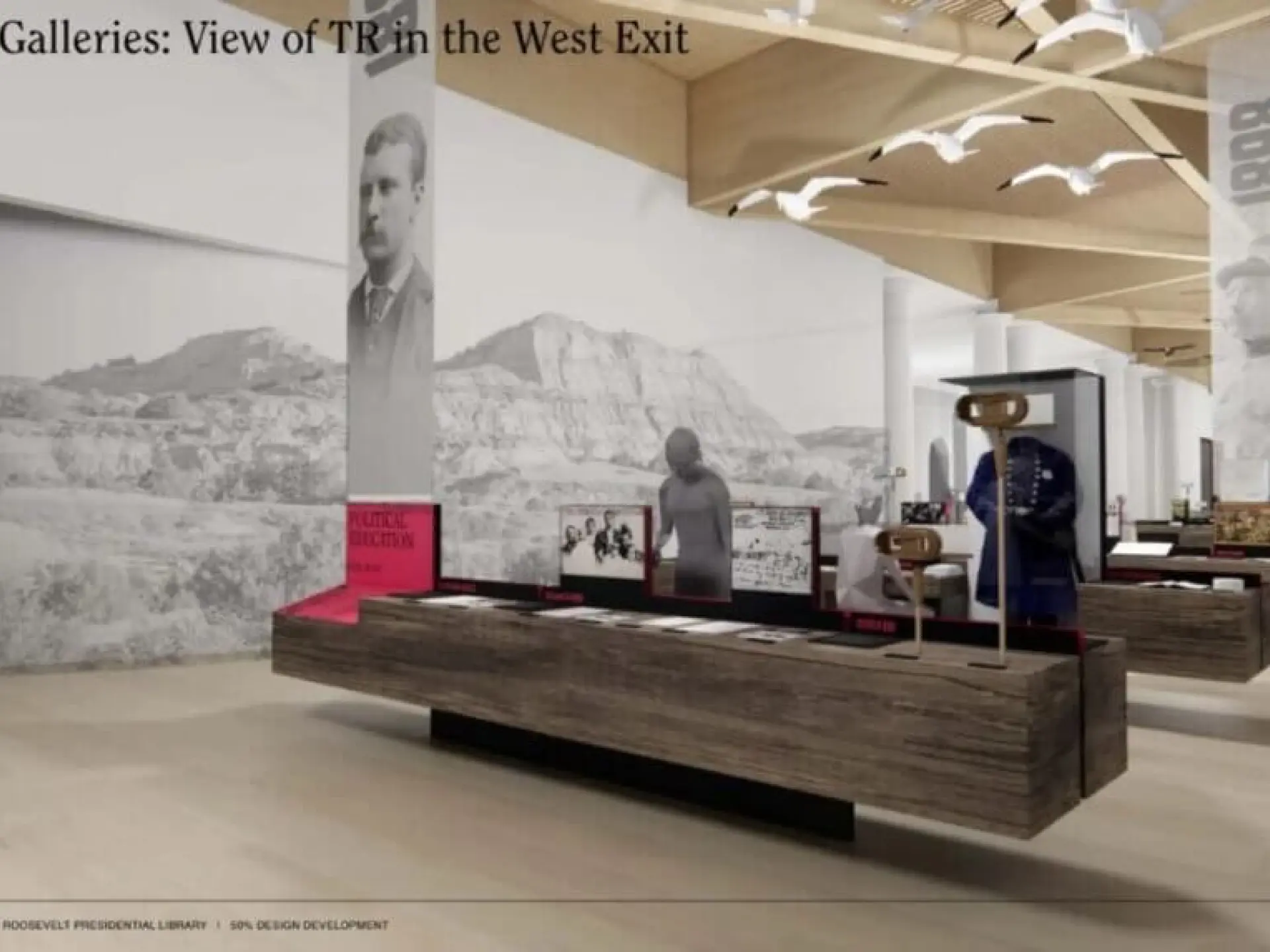 Museum exhibit with long display cases and historical photos on walls.