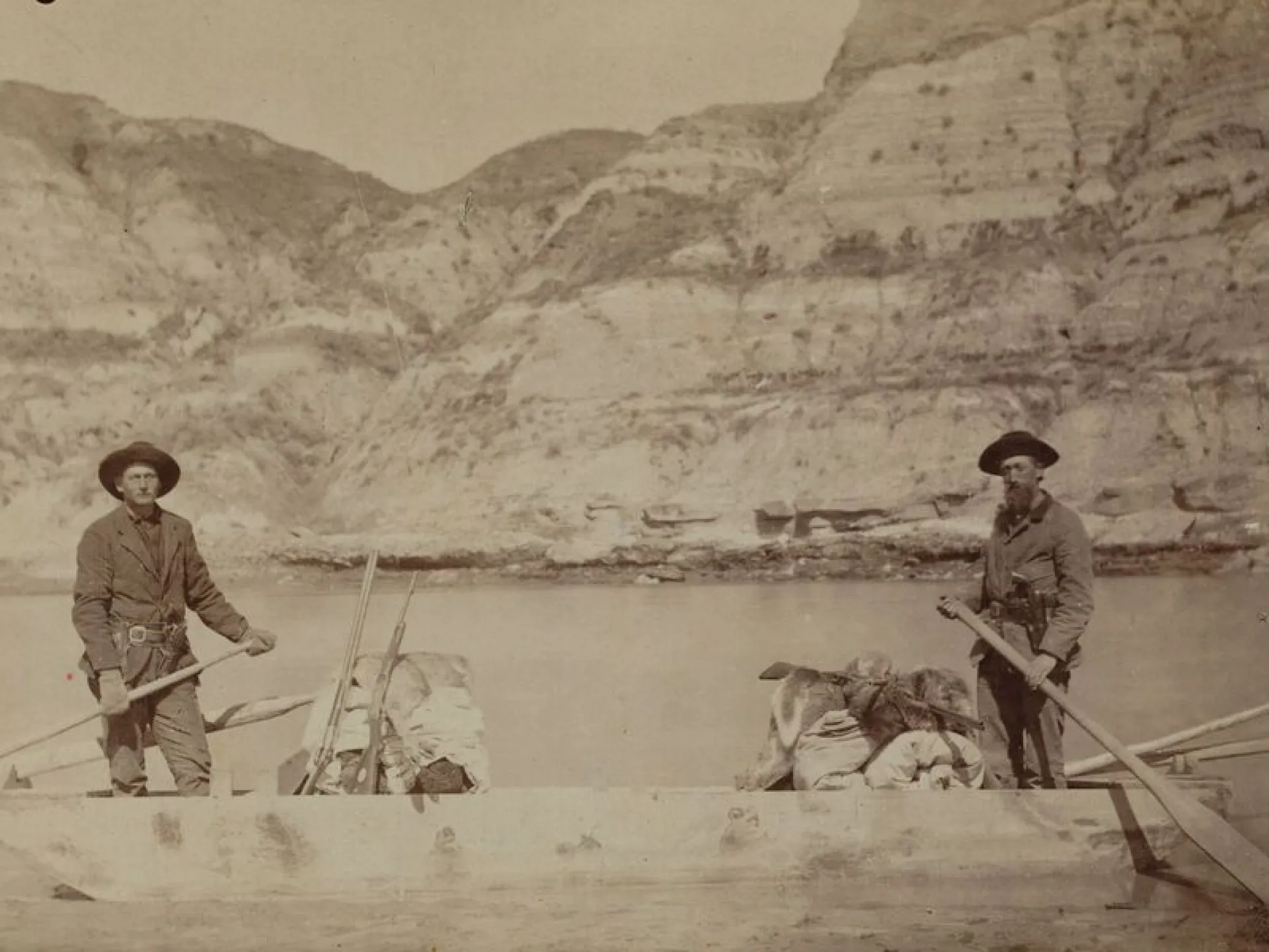 Bill Sewall and Wilmot Dow aboard the flat-bottomed boat on the Little Missouri