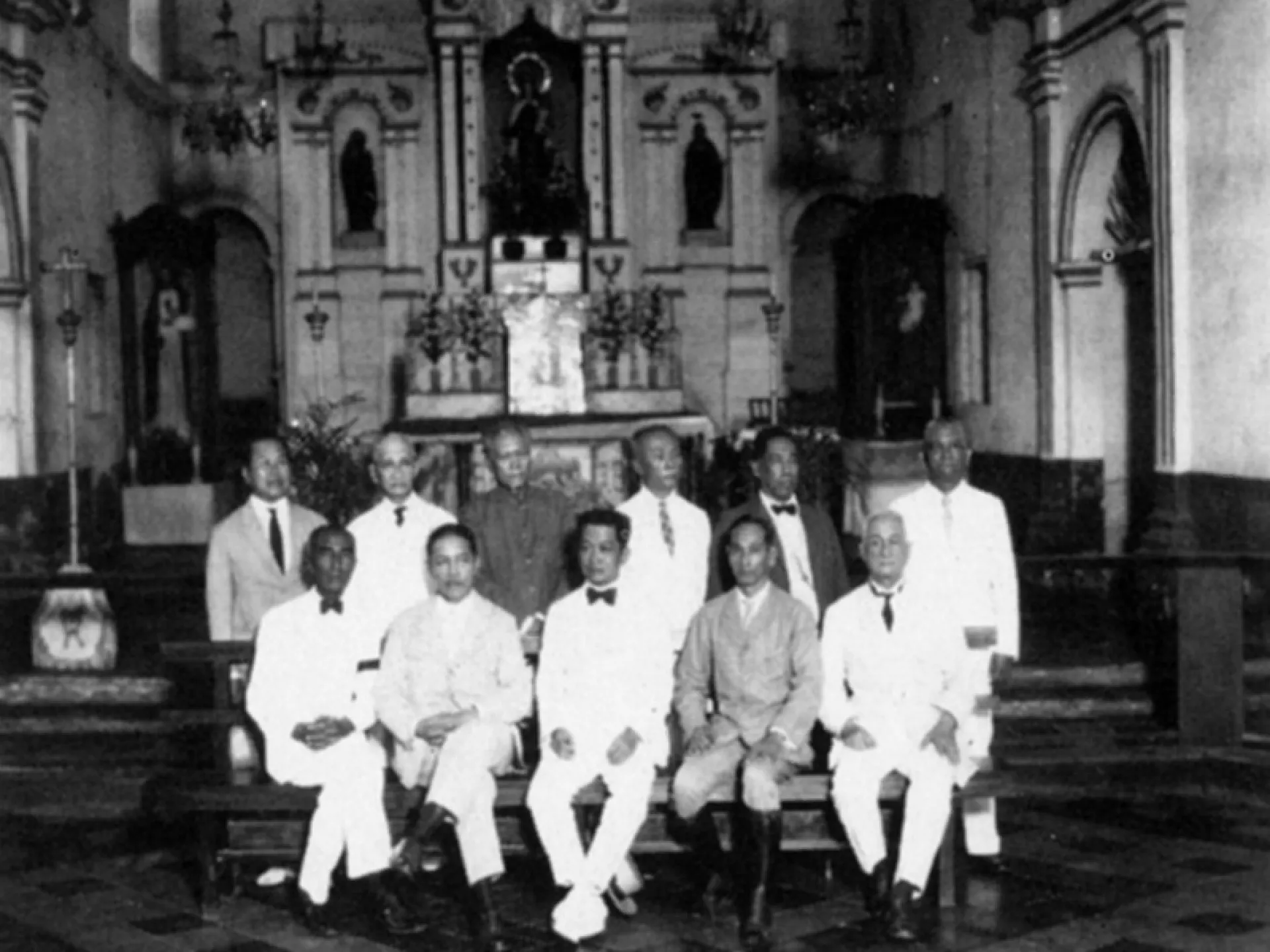 General Emilio Aguinaldo seated with delegates of the First Philippine Republic inside a church.