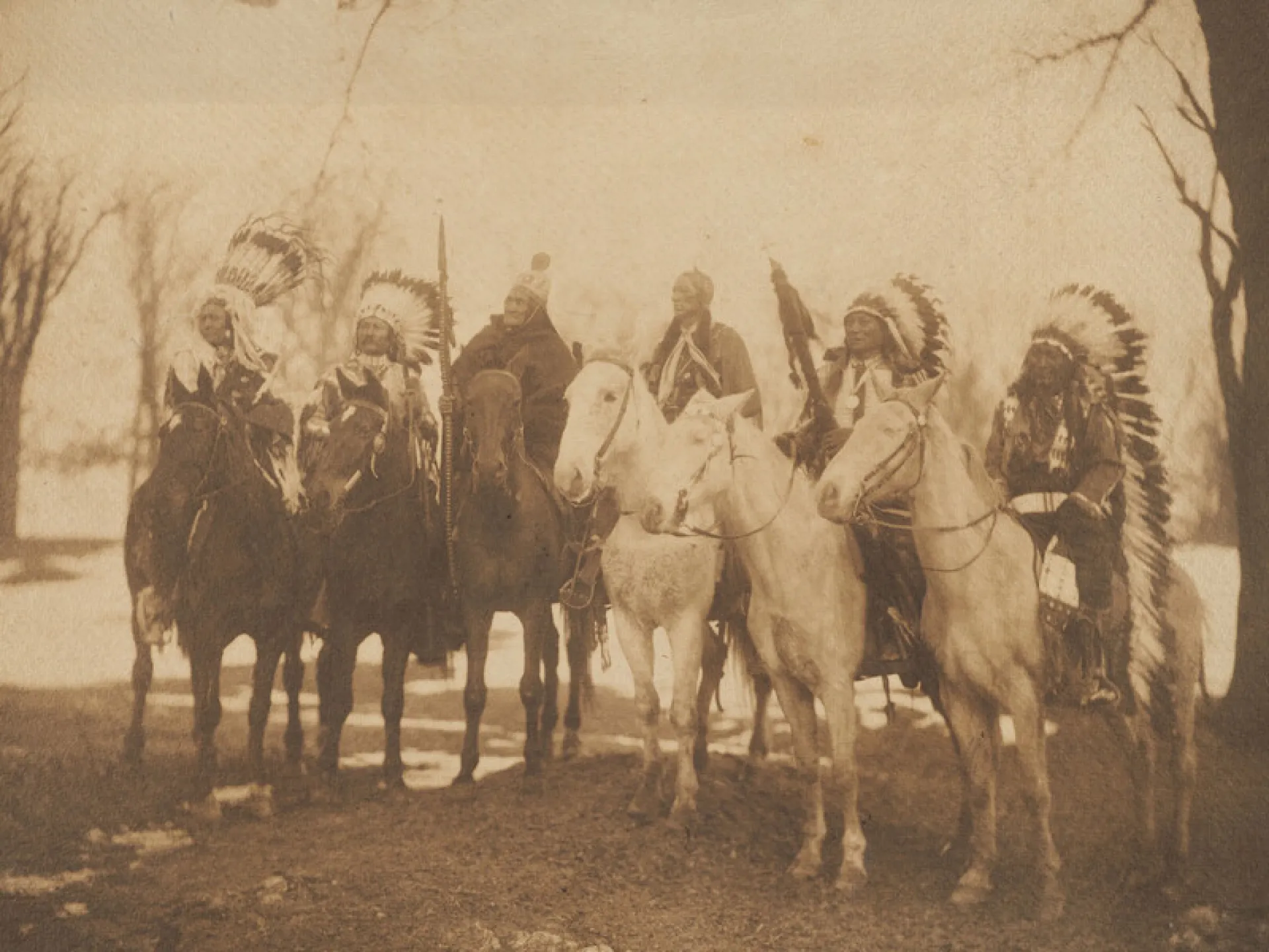 Native American chiefs in feather headdresses on horseback in Theodore Roosevelt's 1905 inaugural parade.