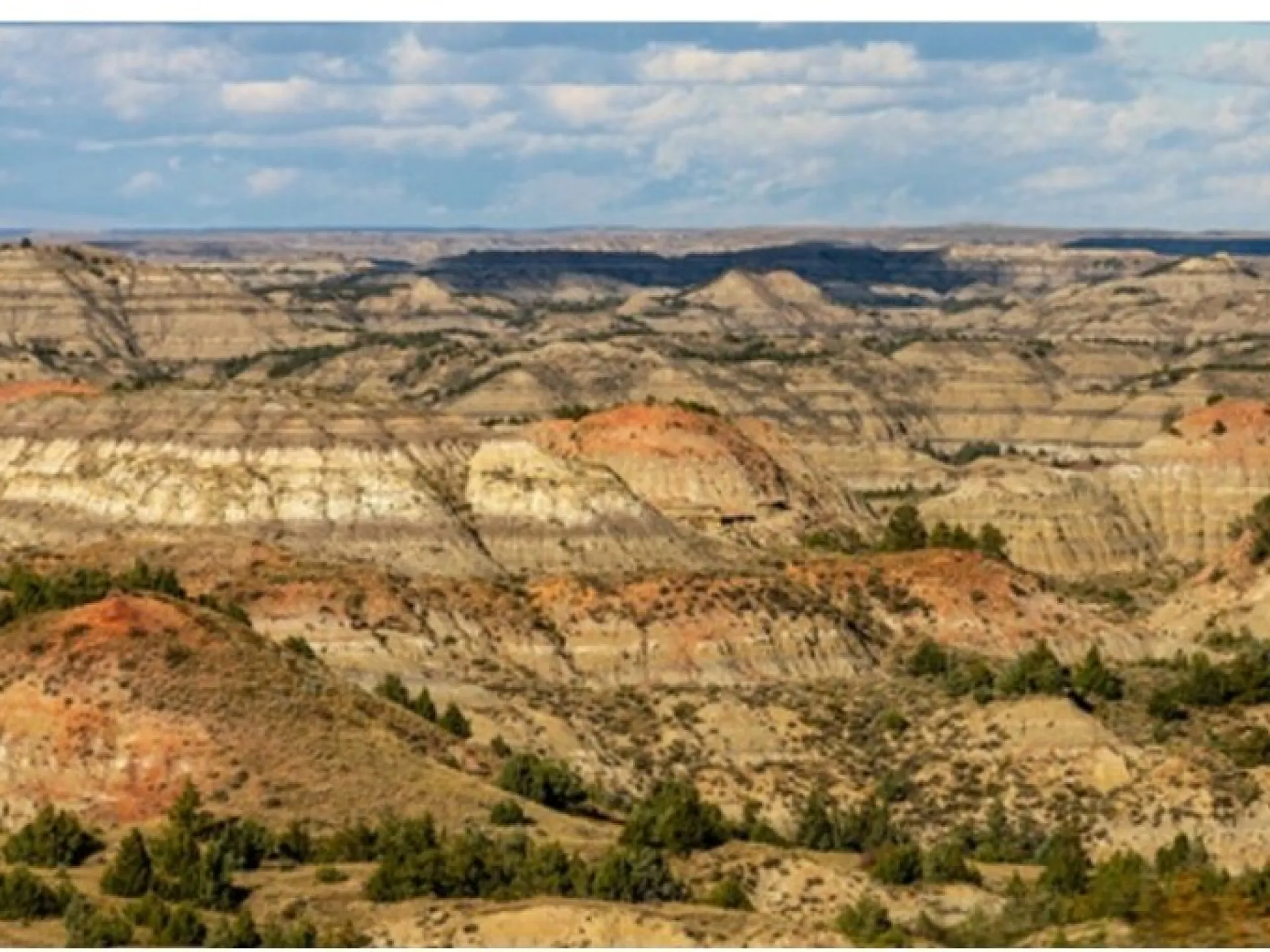 Wide view of banded badlands buttes and eroded draws in the South Unit of Theodore Roosevelt National Park