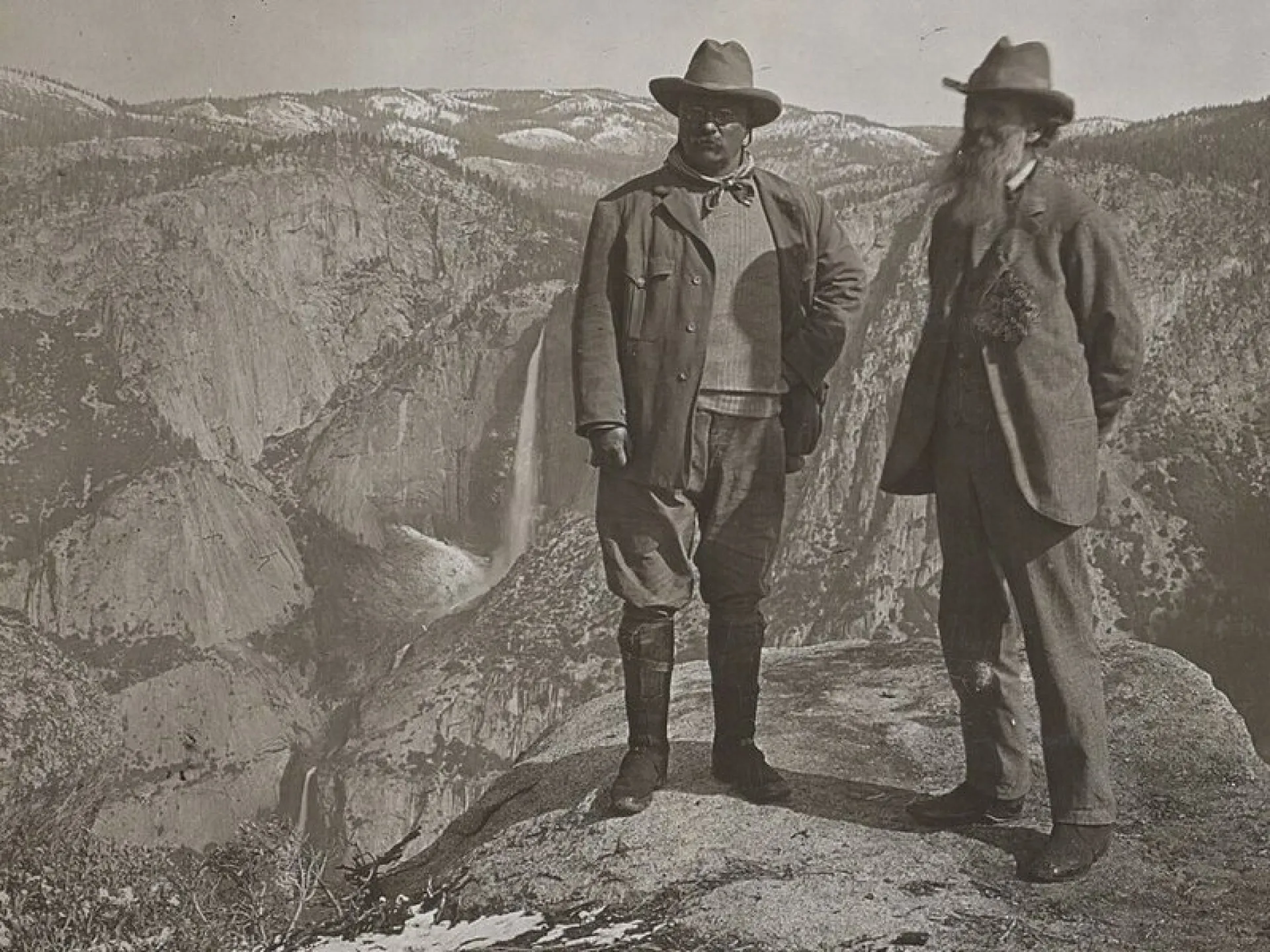 Theodore Roosevelt and John Muir standing at Glacier Point above Yosemite Valley