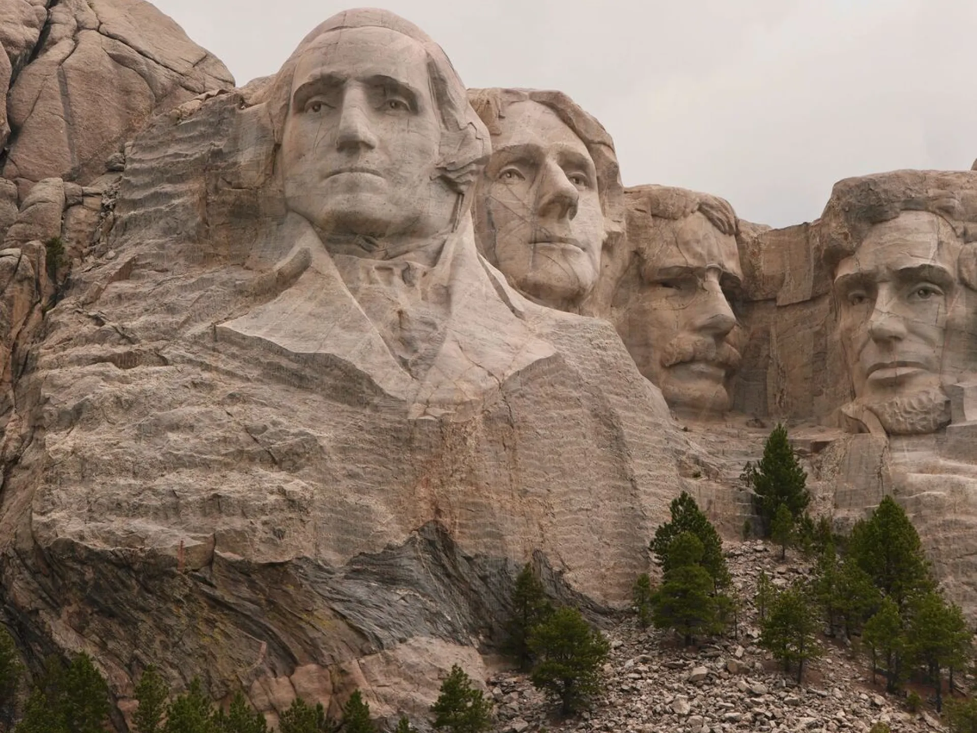 The four presidential faces of Mount Rushmore, with Theodore Roosevelt carved between Jefferson and Lincoln