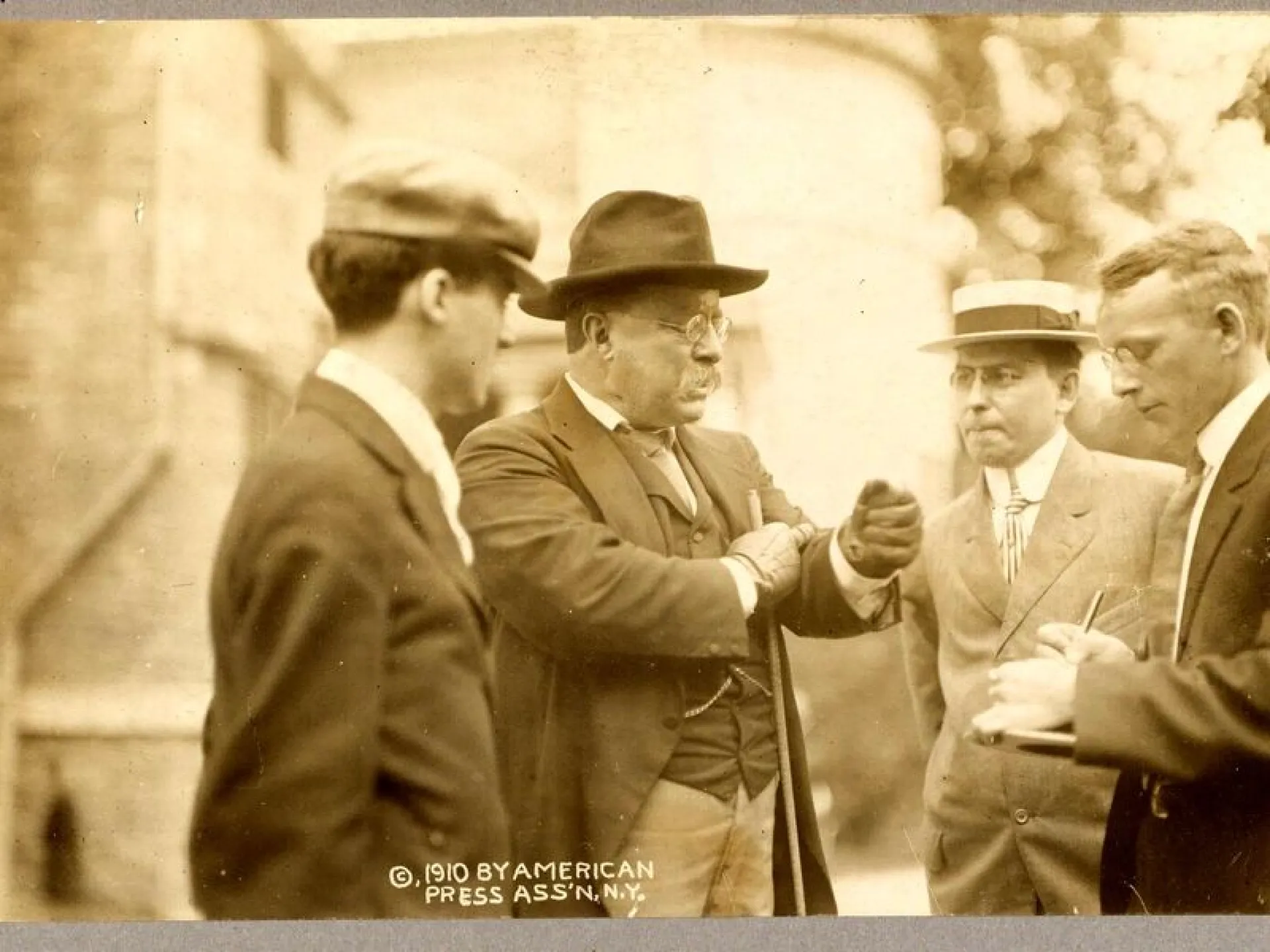 Theodore Roosevelt in conversation with reporters