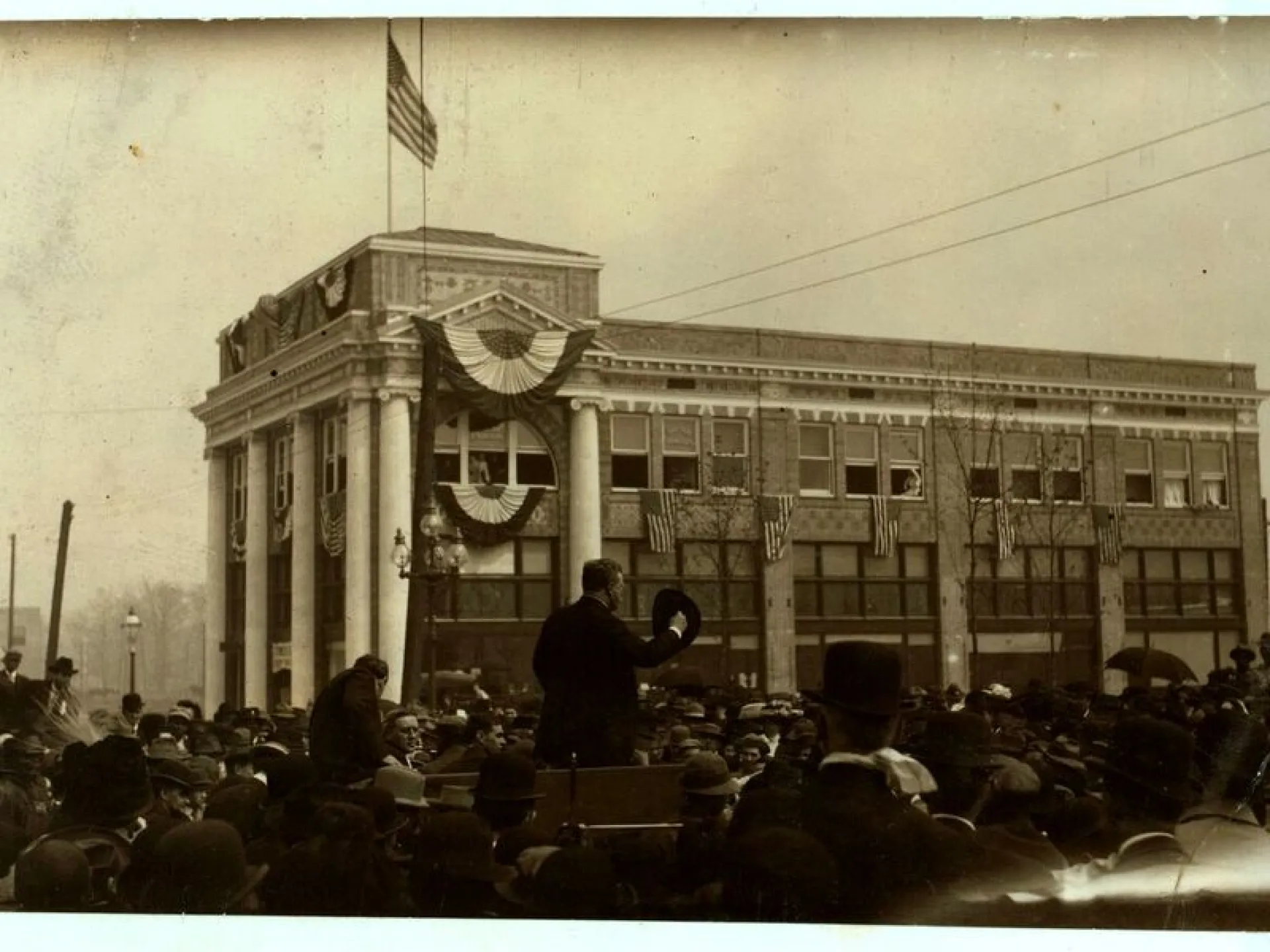 Theodore Roosevelt addressing a large outdoor crowd