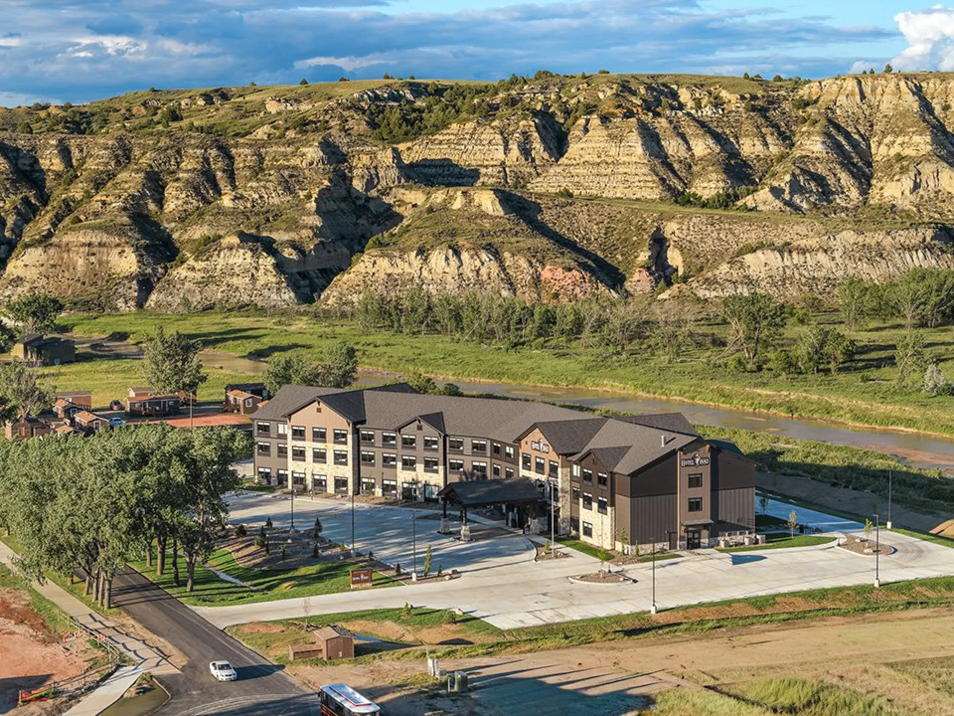Aerial view of Hotel 1883 beneath Badlands buttes in Medora, North Dakota.