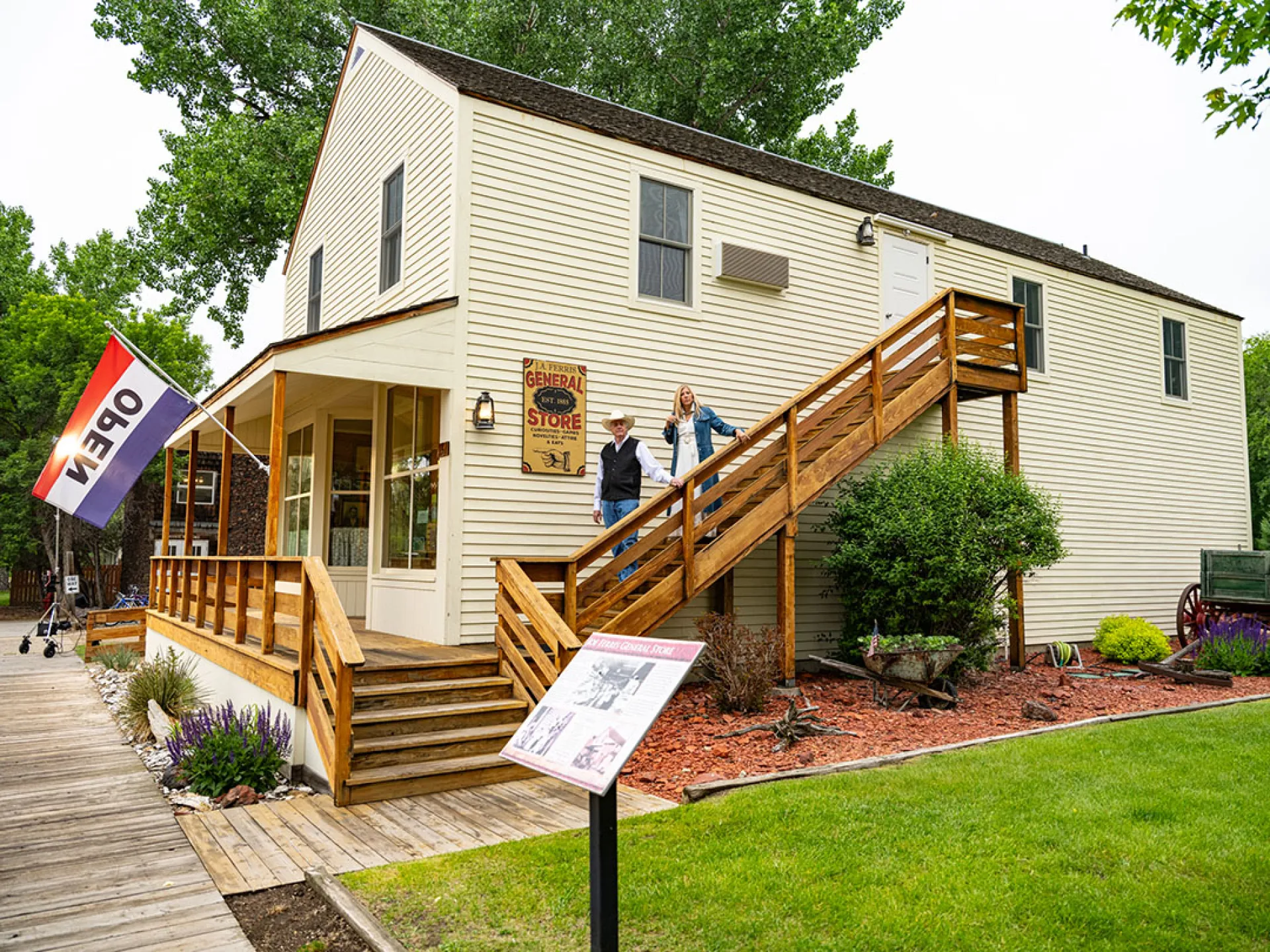 The two-story cream Ferris Inn with an outside stair and a General Store sign on its porch