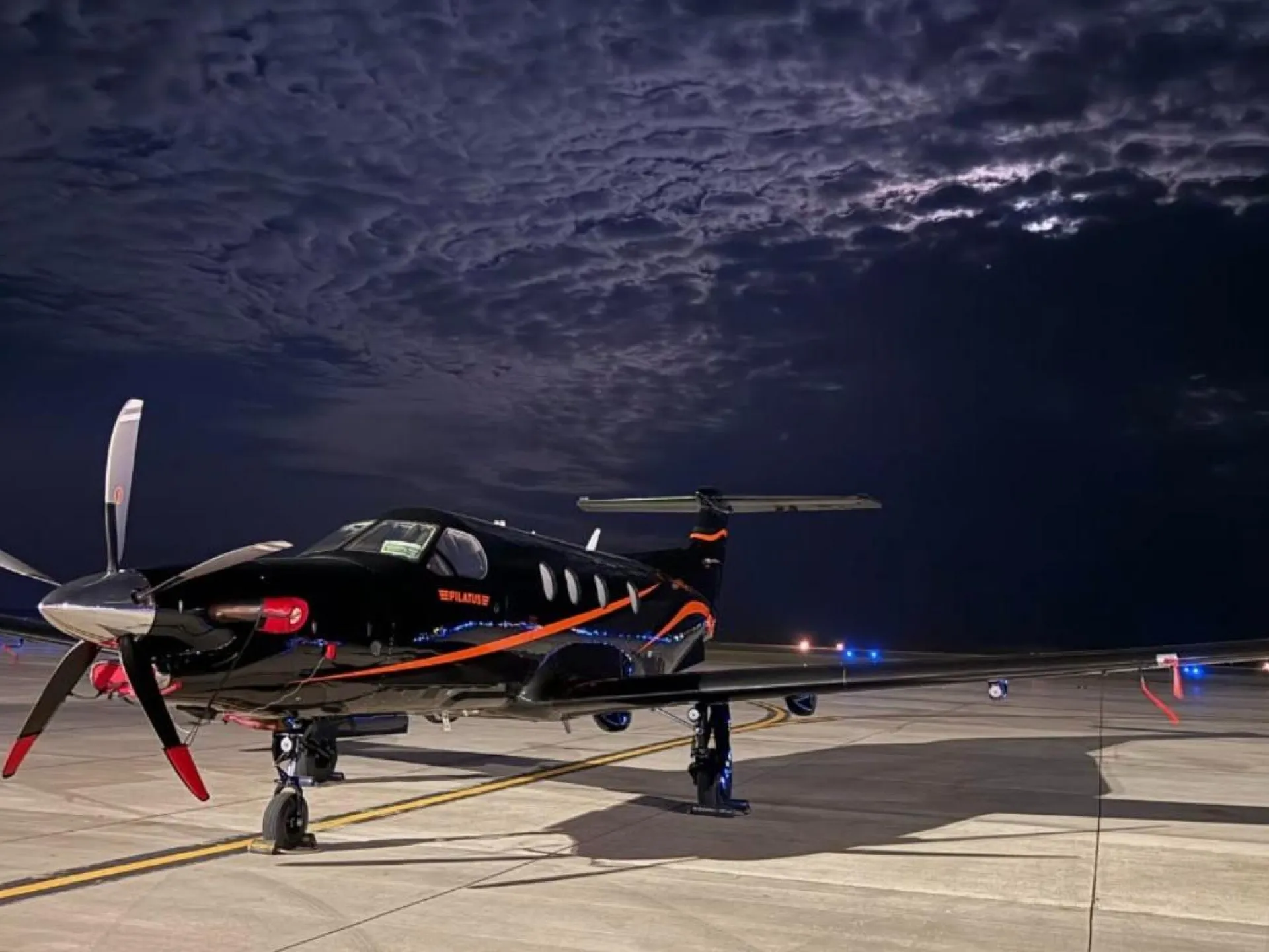 A Pilatus PC-12 turboprop on the ramp at Williston Basin International Airport before dawn