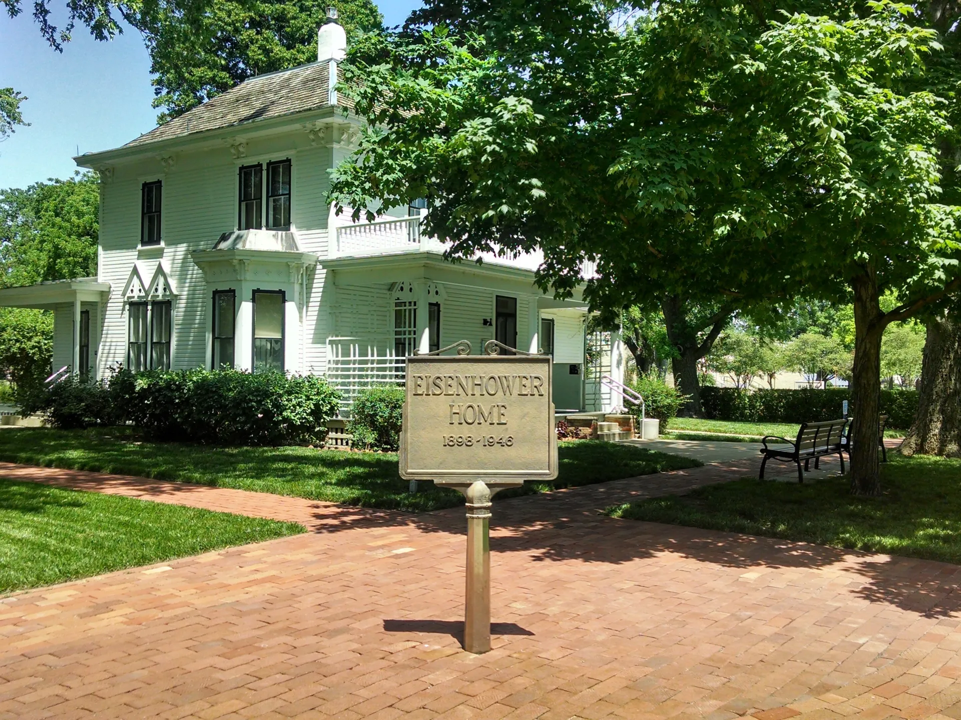 A white two-story frame house with a front porch