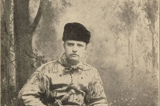 Theodore Roosevelt in fringed buckskin with his rifle
