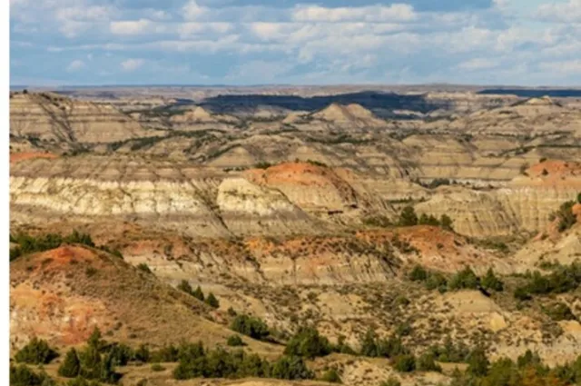 Wide view of banded badlands buttes and eroded draws in the South Unit of Theodore Roosevelt National Park