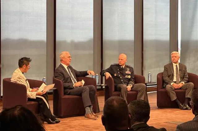 Panelists including General Michael Guetlein seated on stage at the Carry a Big Stick defense forum