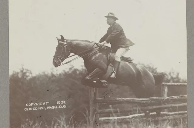 Theodore Roosevelt on horseback, his horse clearing a fence