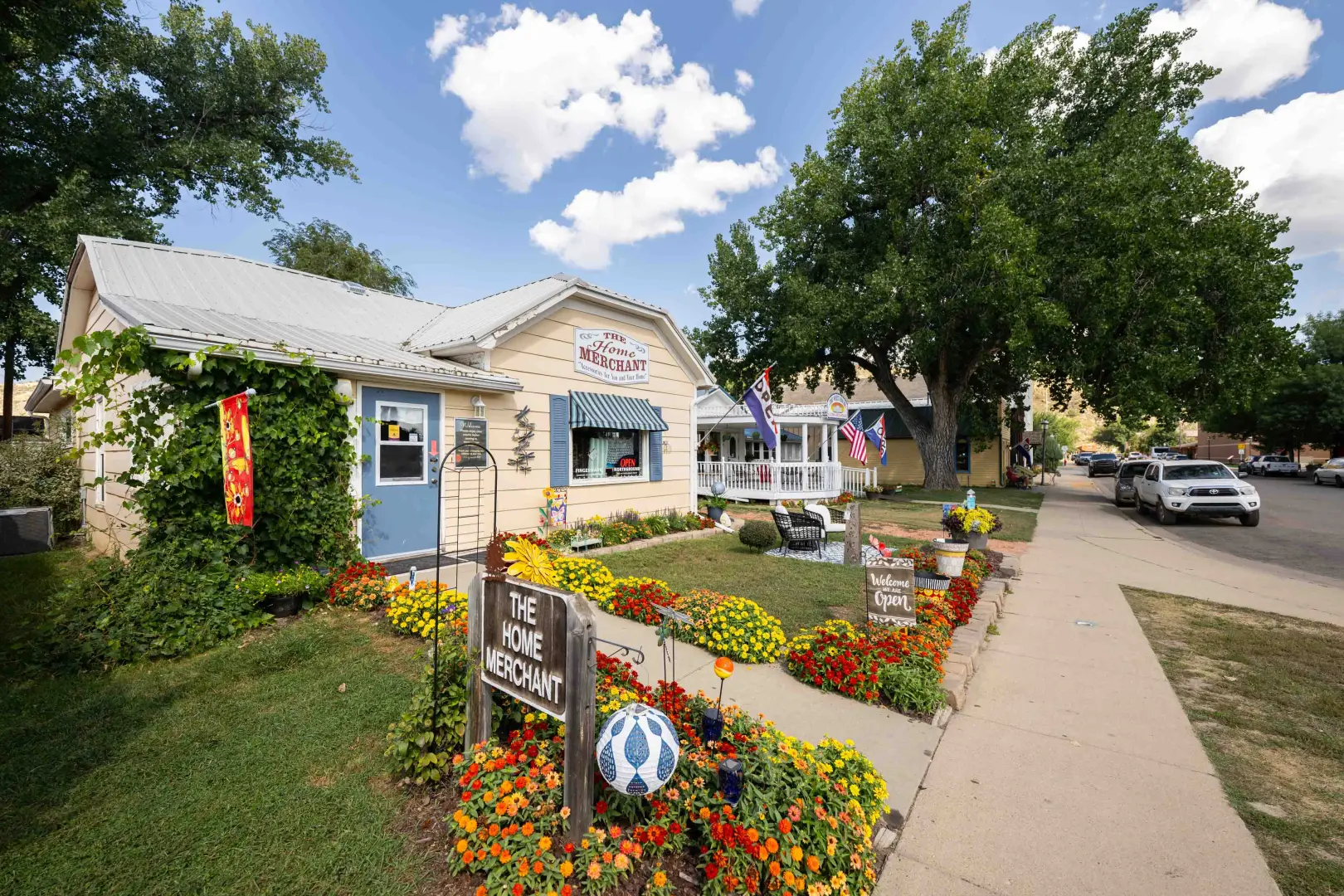 sidewalk with flowers leading to shop