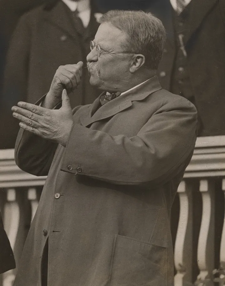 President Theodore Roosevelt gesturing as he delivers a speech
