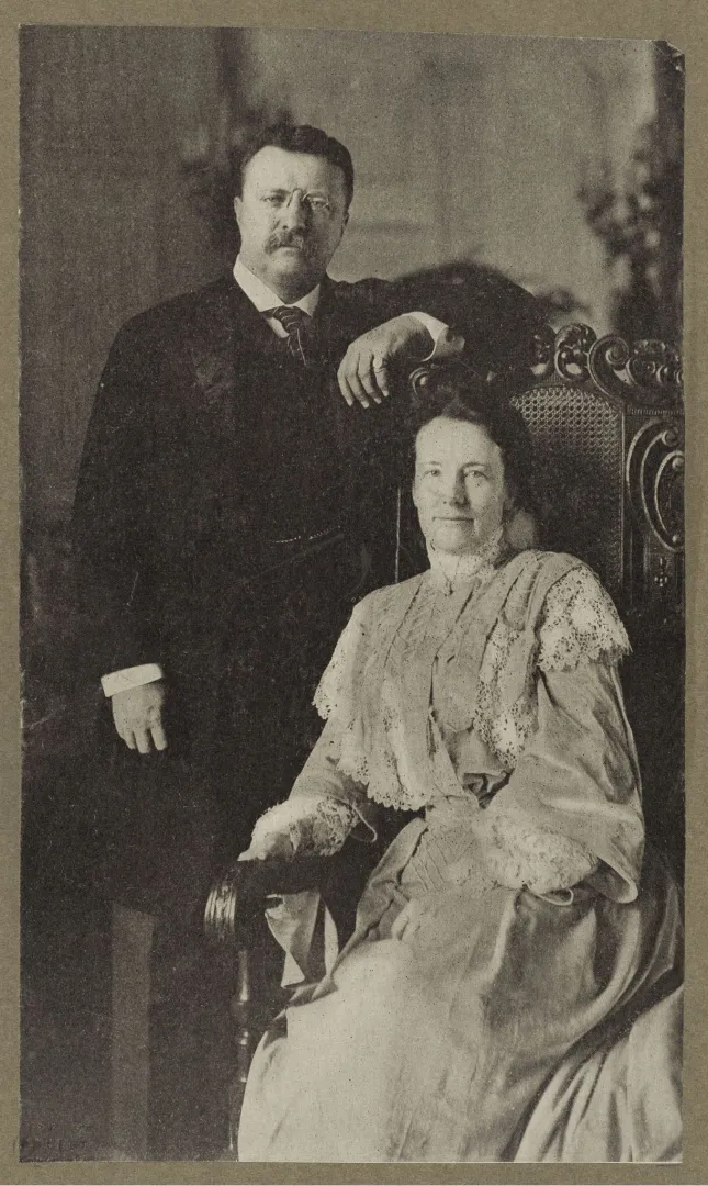 Theodore Roosevelt standing beside a seated Edith Roosevelt in a formal portrait