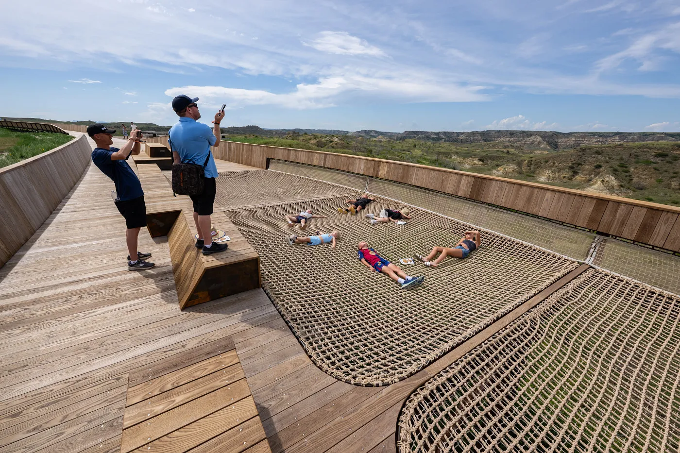 Visitors on the Library rooftop boardwalk overlooking the Badlands landscape