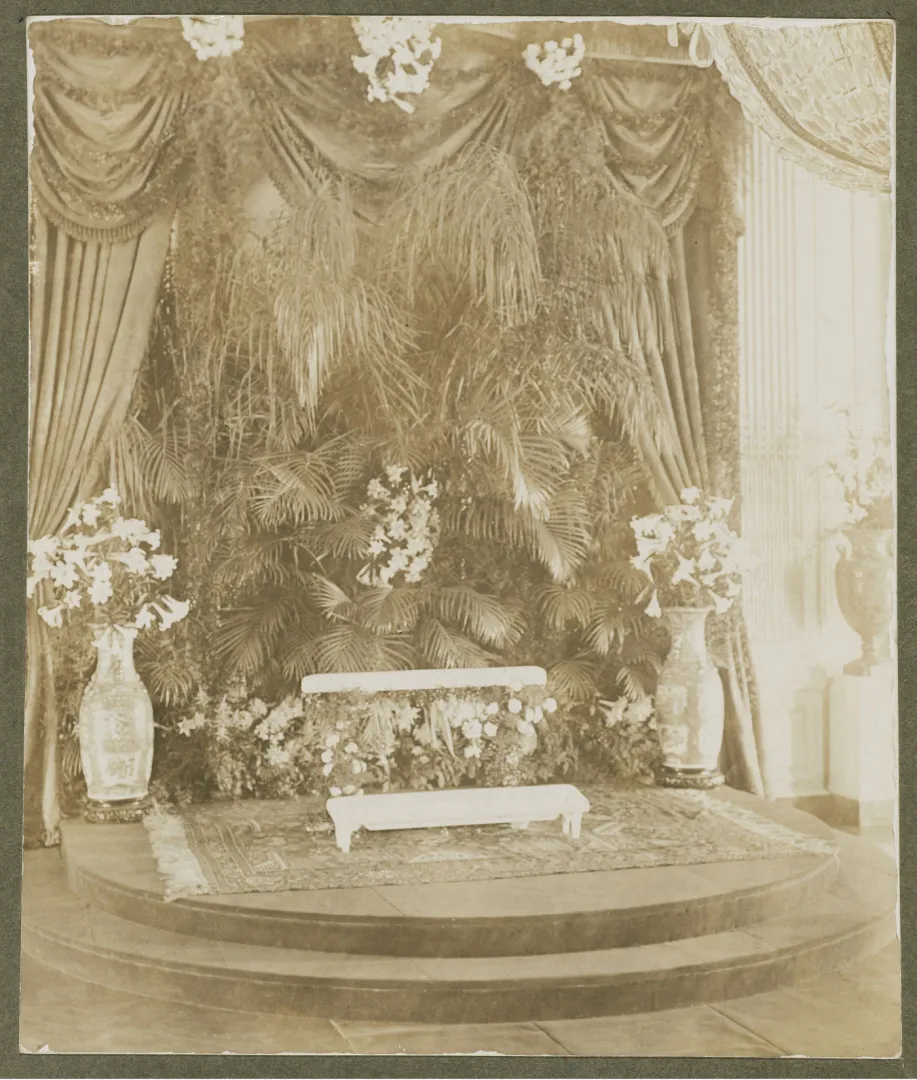 The East Room of the White House banked with palms and flowers for a wedding during the Roosevelt years