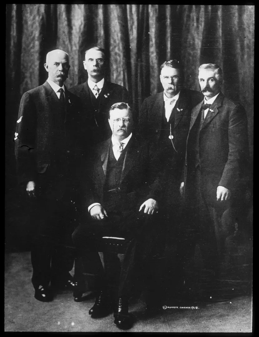 Theodore Roosevelt seated with Rough Rider veterans during the 1912 Bull Moose campaign