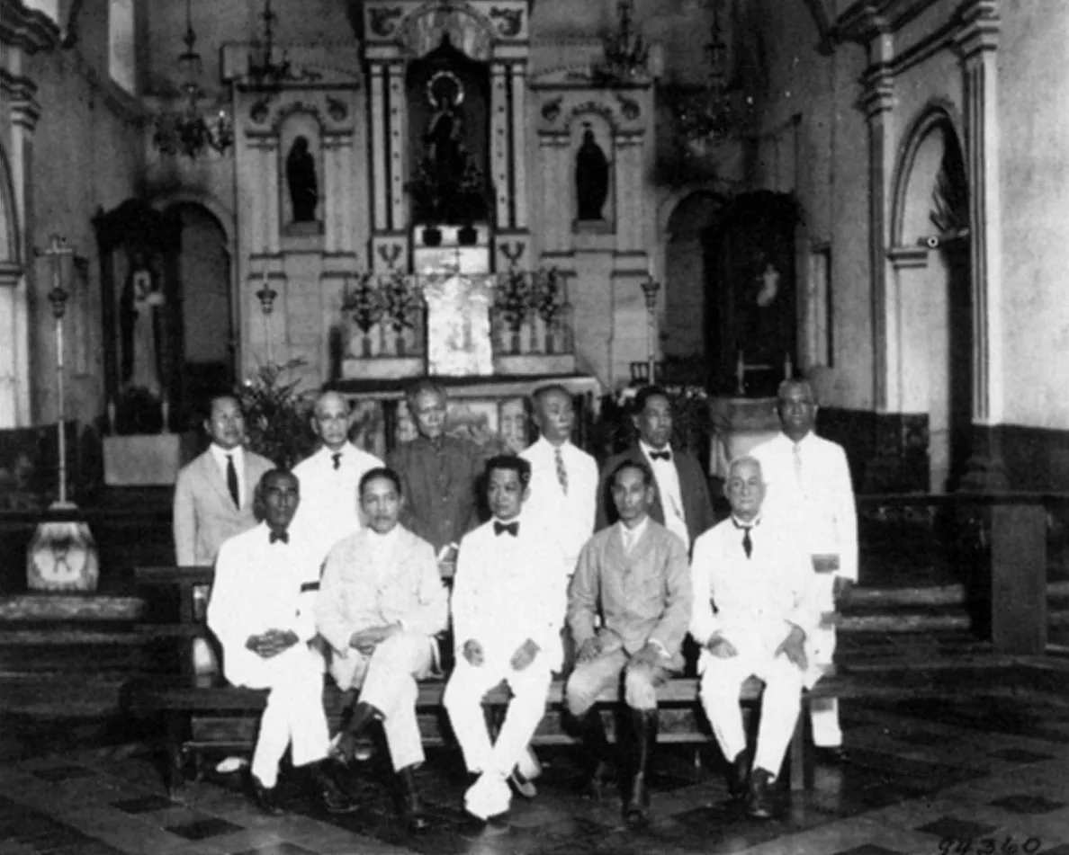 General Emilio Aguinaldo seated with delegates of the First Philippine Republic inside a church
