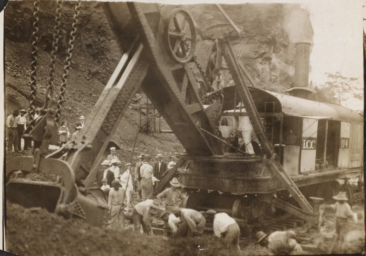 Steam shovel and workers excavating rock in the Culebra Cut, Panama Canal Zone