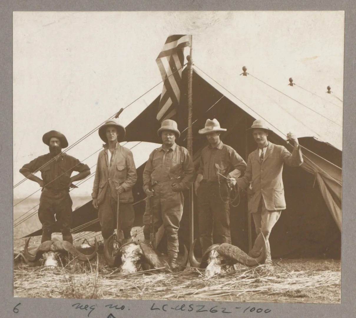 Kermit and Theodore Roosevelt with expedition naturalists in camp