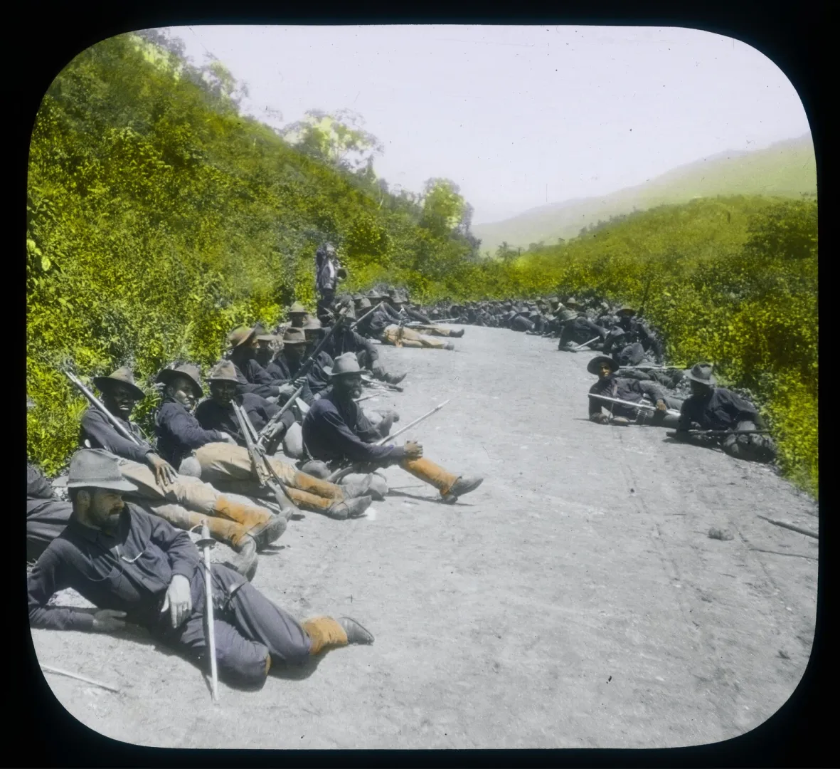 Black soldiers of a U.S. Army infantry regiment resting in the field