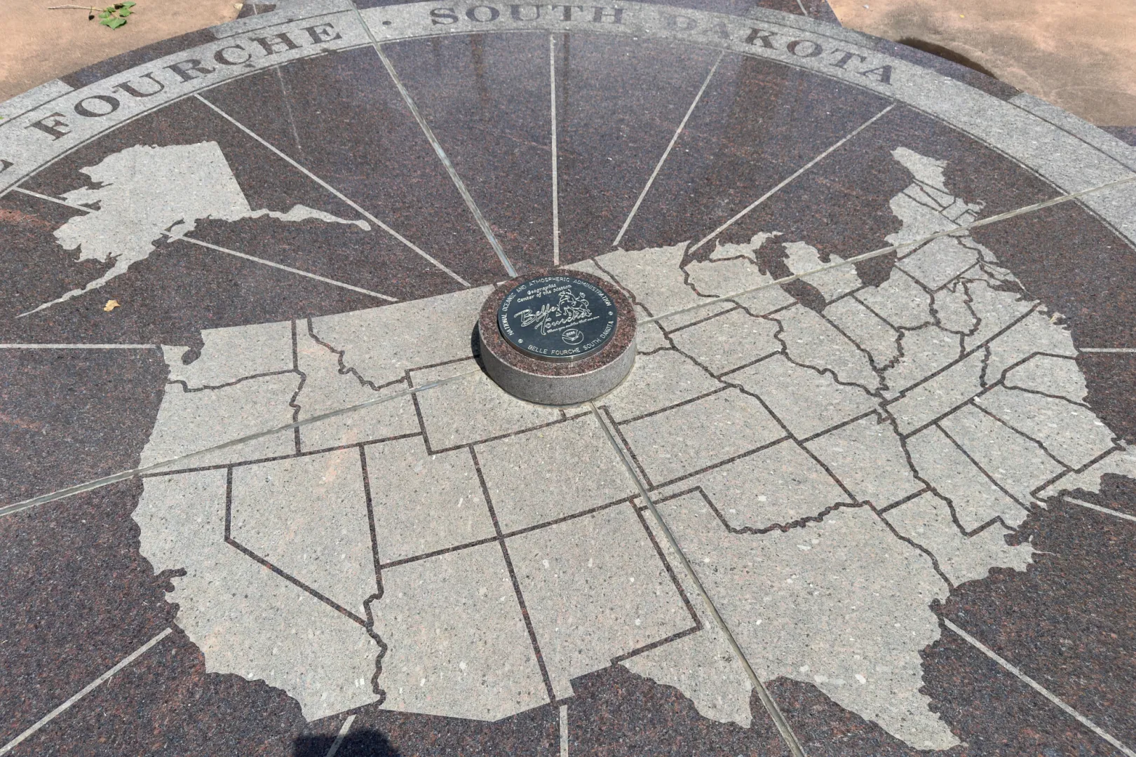The granite compass rose marking the geographic center of the nation at Belle Fourche, South Dakota, with a map of the United States inlaid in stone