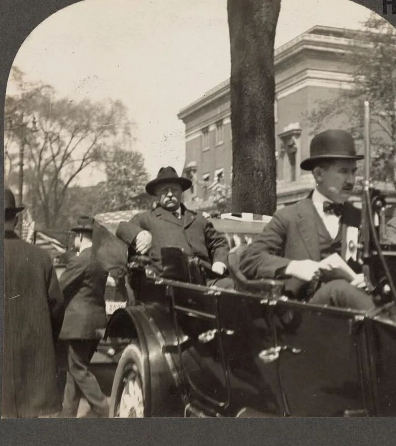 Roosevelt riding in an open car during the 1912 campaign