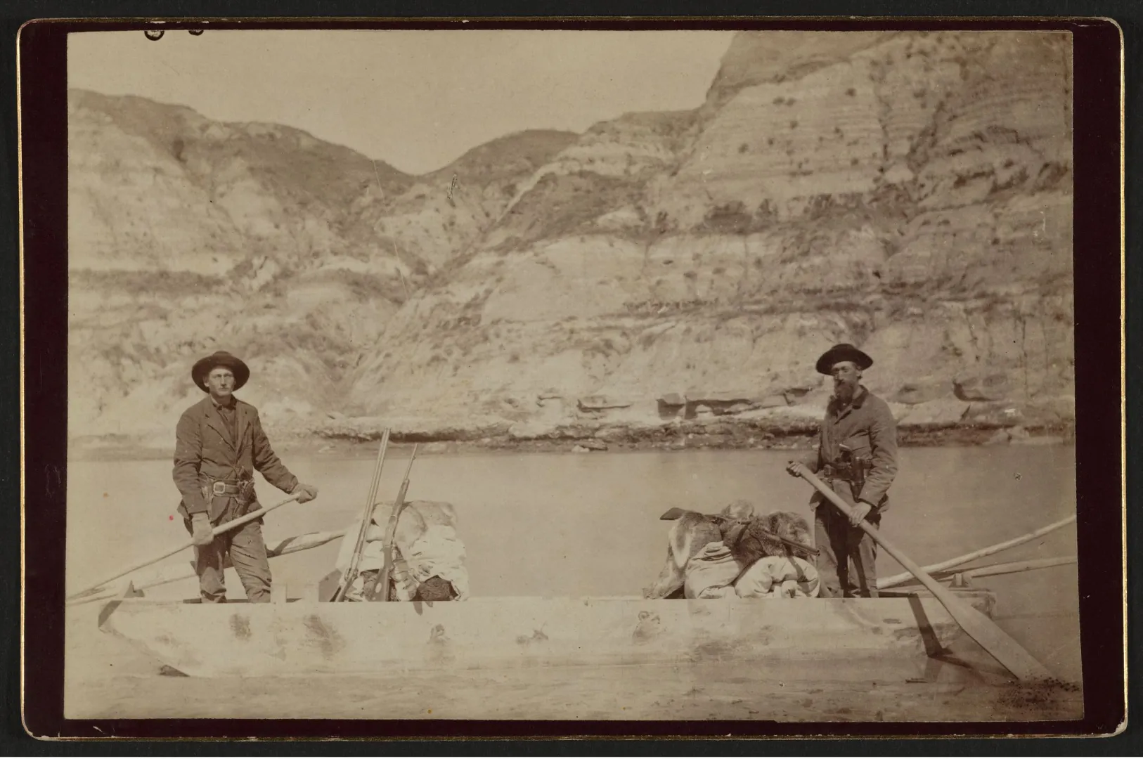 Bill Sewall and Wilmot Dow aboard the flat-bottomed boat on the Little Missouri