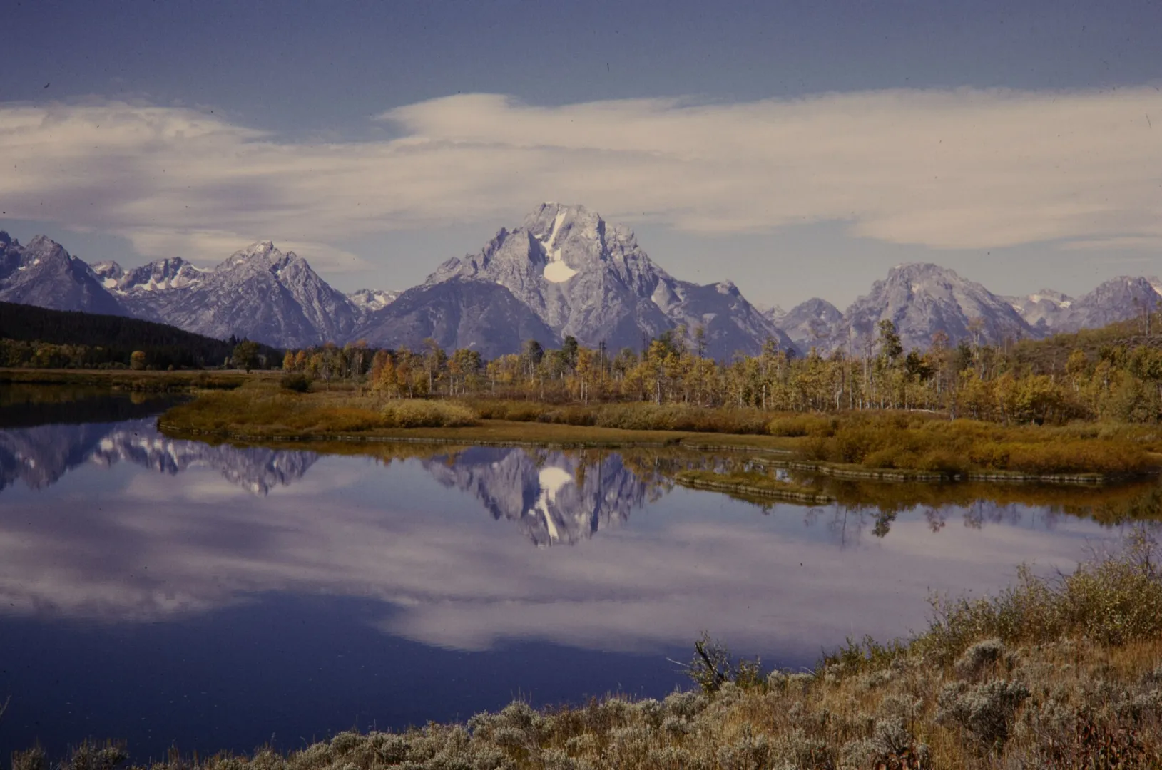 The Teton Range reflected in the Snake River at Oxbow Bend, Grand Teton National Park, in autumn