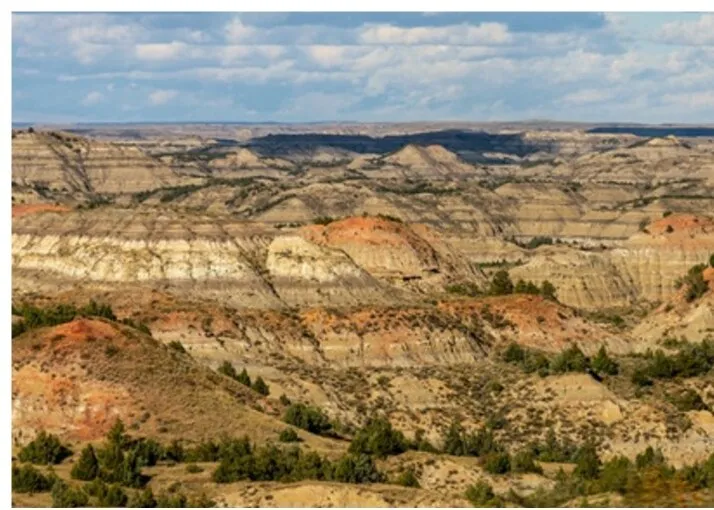 Wide view of banded badlands buttes and eroded draws in the South Unit of Theodore Roosevelt National Park