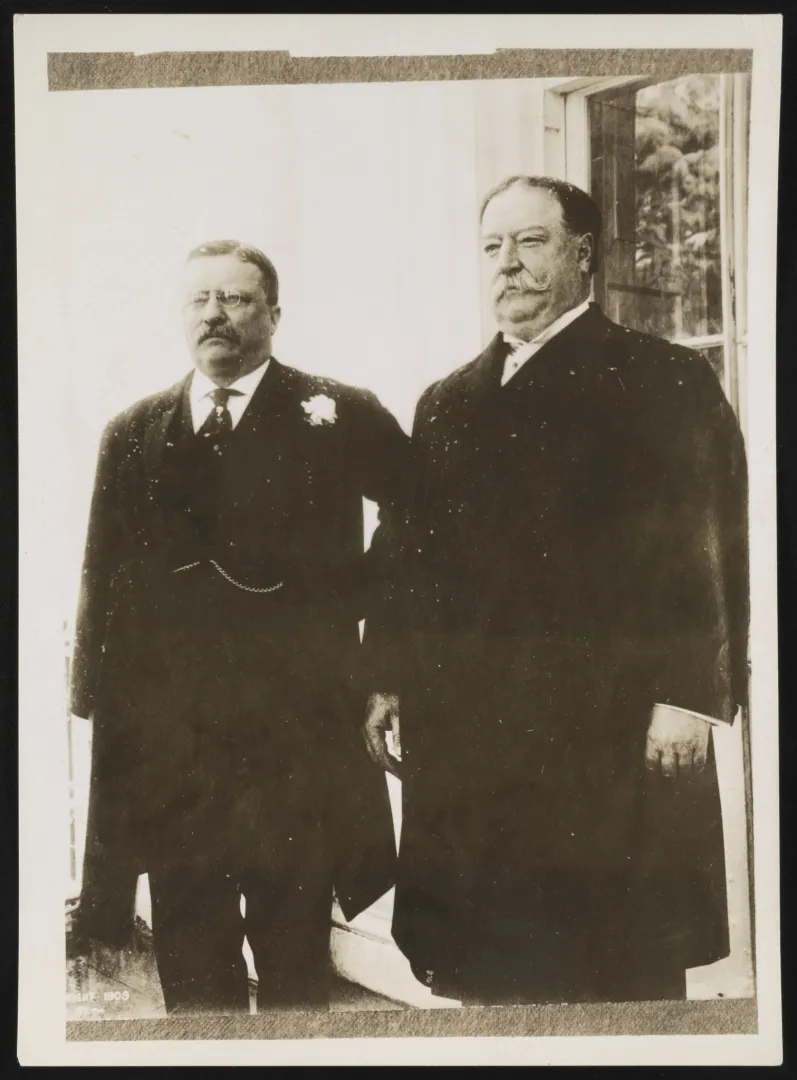 Theodore Roosevelt standing beside William Howard Taft