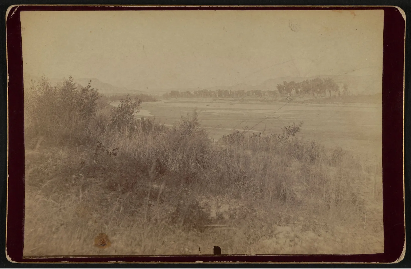 The Little Missouri River winding through quiet bottomland below the Elkhorn Ranch