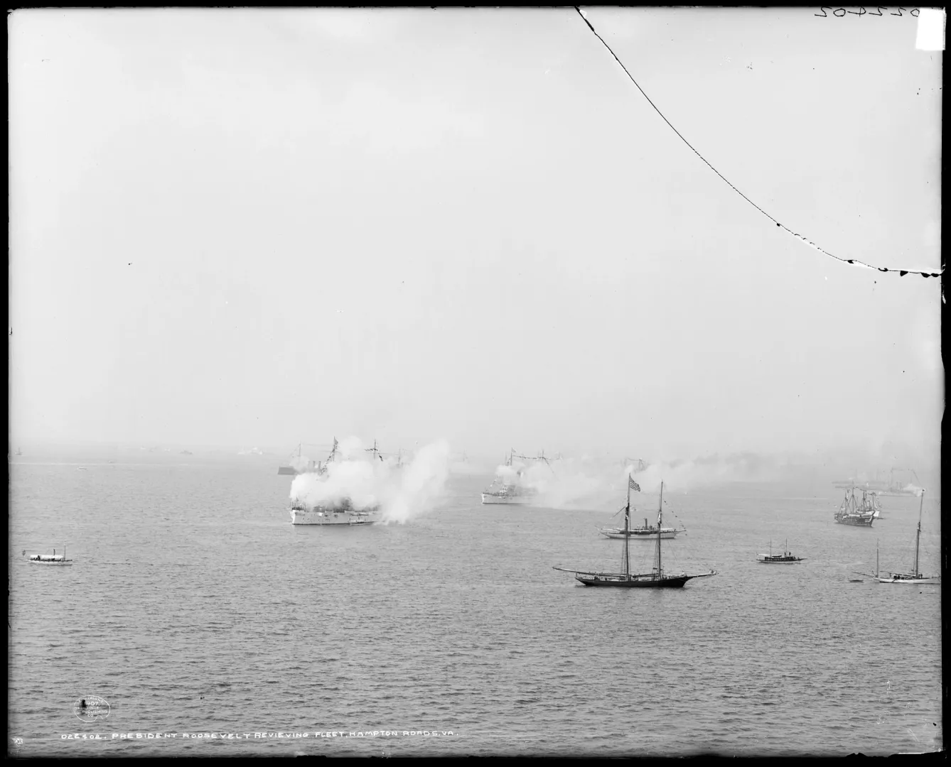 Ships of the U.S. Great White Fleet firing salutes during a naval review at sea