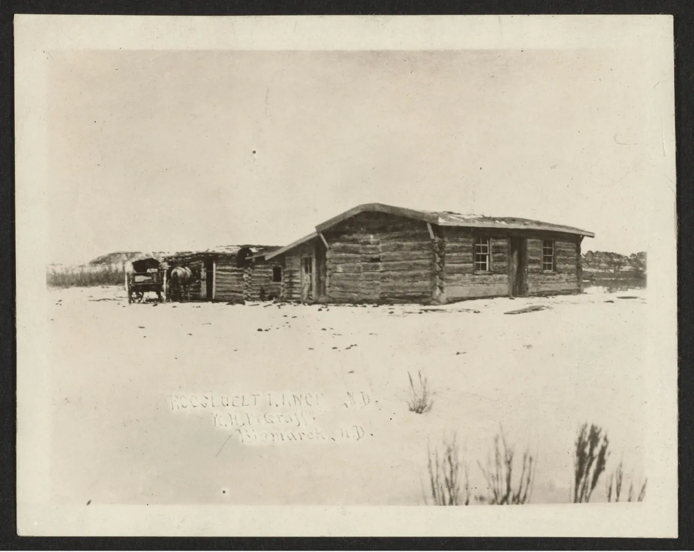 A log ranch building on the snow-covered Dakota plains in winter.