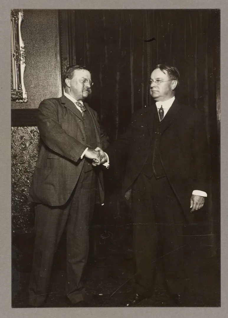 Theodore Roosevelt shaking hands with running mate Hiram Johnson after their 1912 Progressive Party nomination