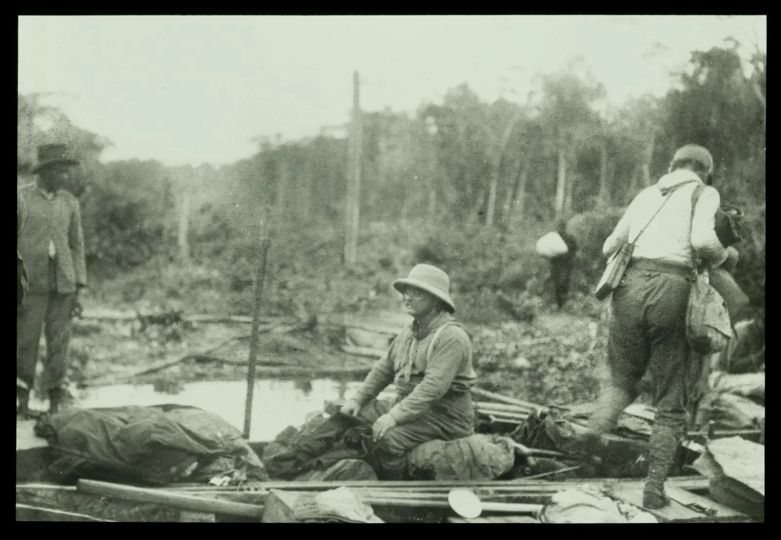 Members of the Roosevelt-Rondon expedition in a dugout canoe on Brazil’s River of Doubt, 1913-1914