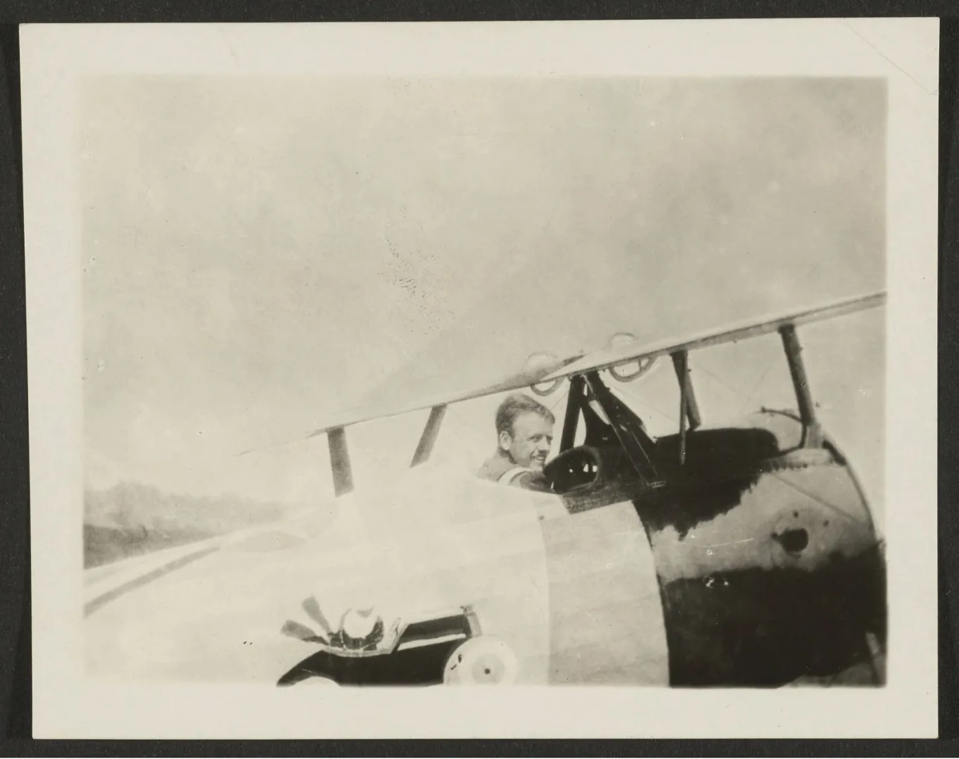Quentin Roosevelt seated in the cockpit of an airplane in France, 1918