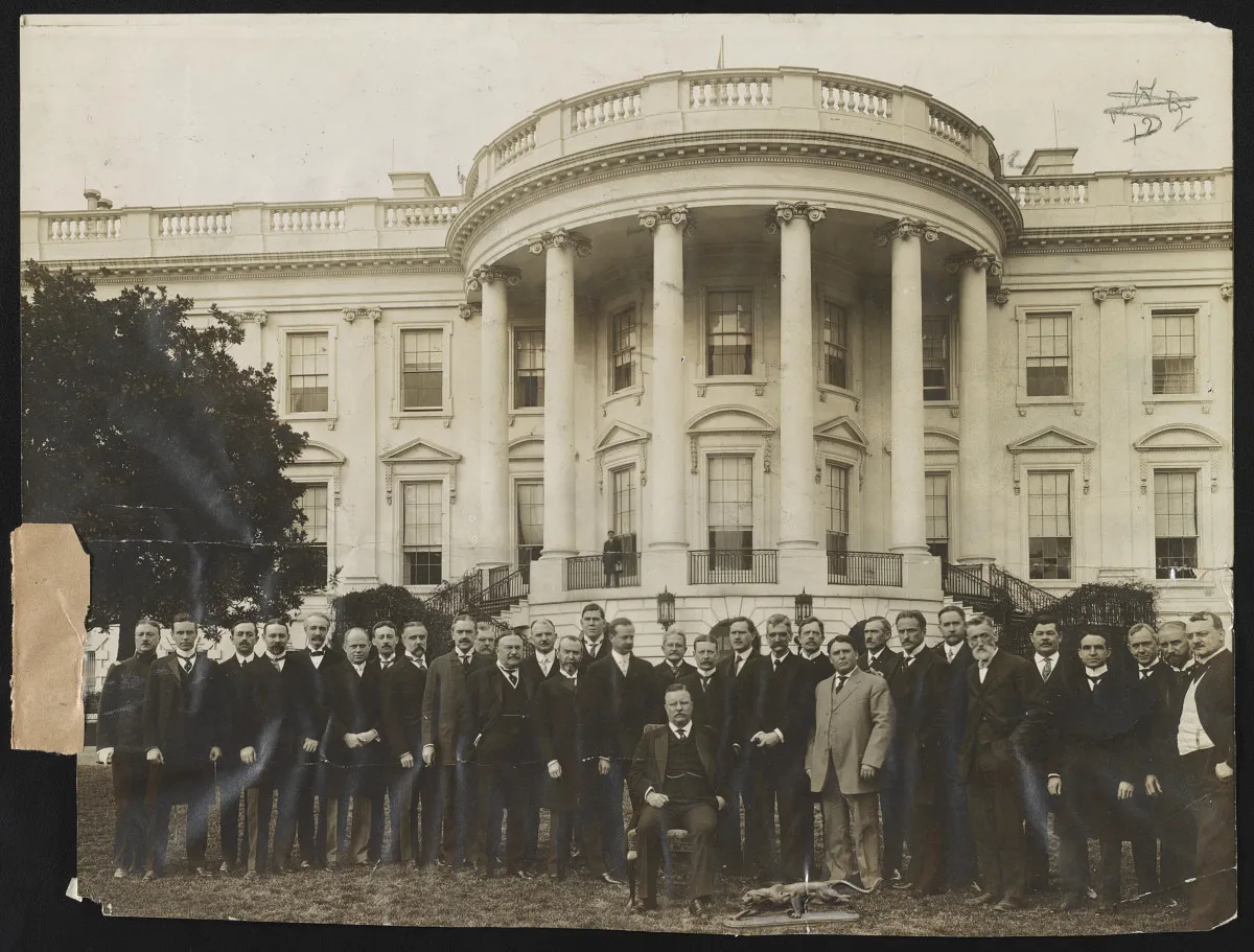 President Roosevelt with a large group of advisers on the White House lawn