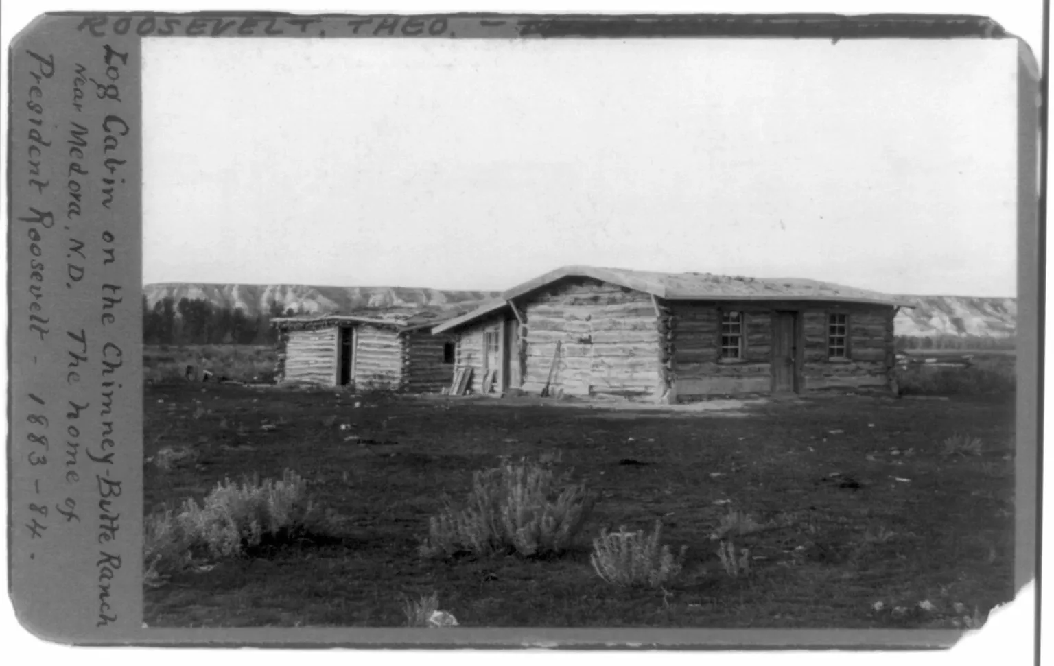 The Maltese Cross Ranch log cabin on the open Badlands prairie