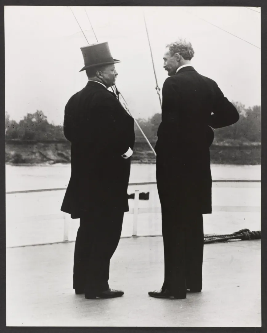 President Theodore Roosevelt and Chief Forester Gifford Pinchot standing together aboard a steamer deck