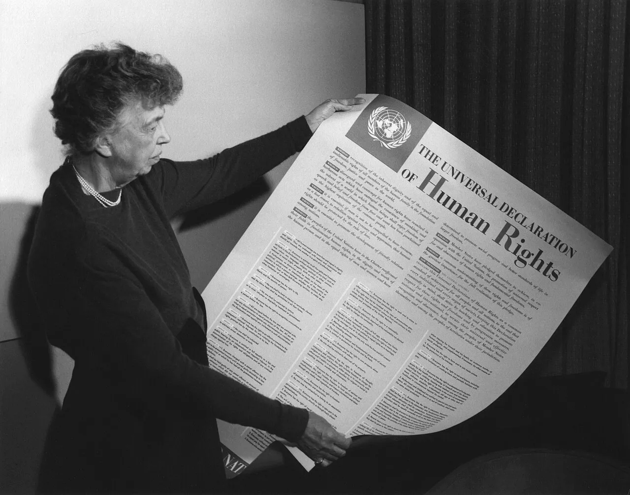 Eleanor Roosevelt holding the Universal Declaration of Human Rights