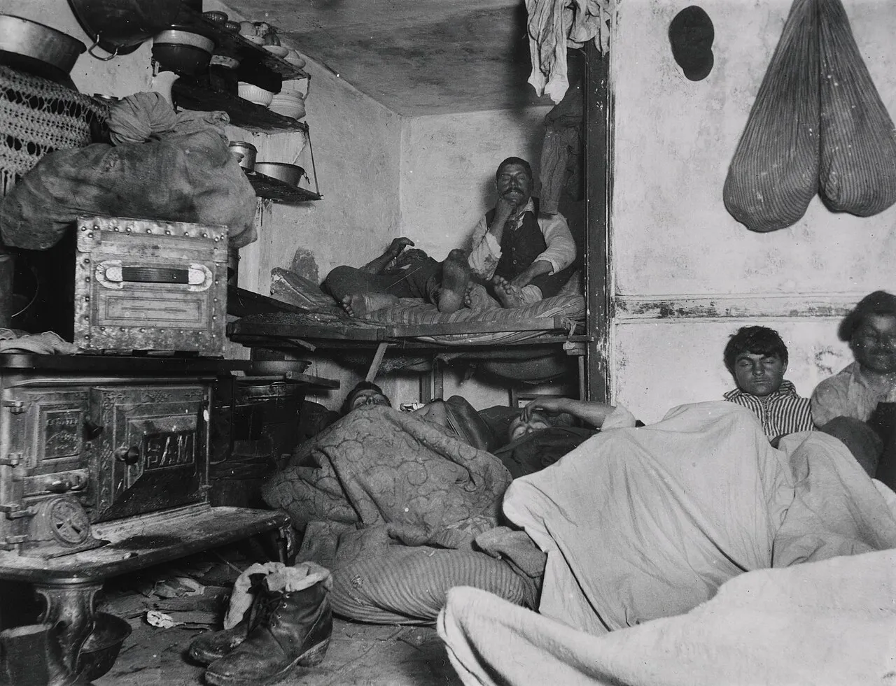 Riis photograph of lodgers crowded in a Bayard Street tenement