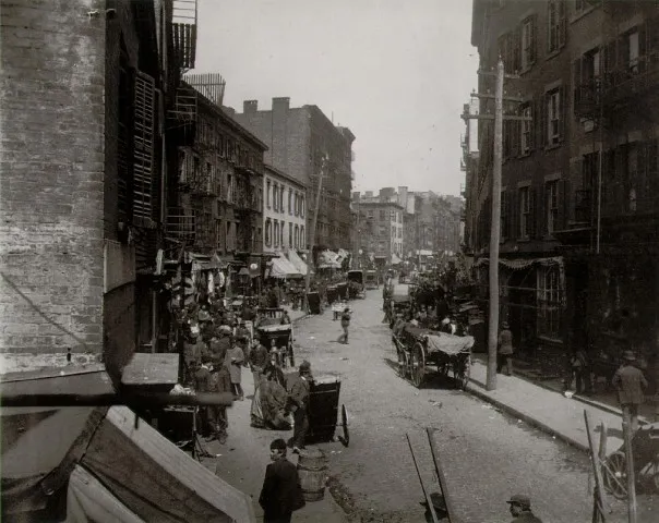 Photograph of a crowded Lower East Side tenement street with pushcarts