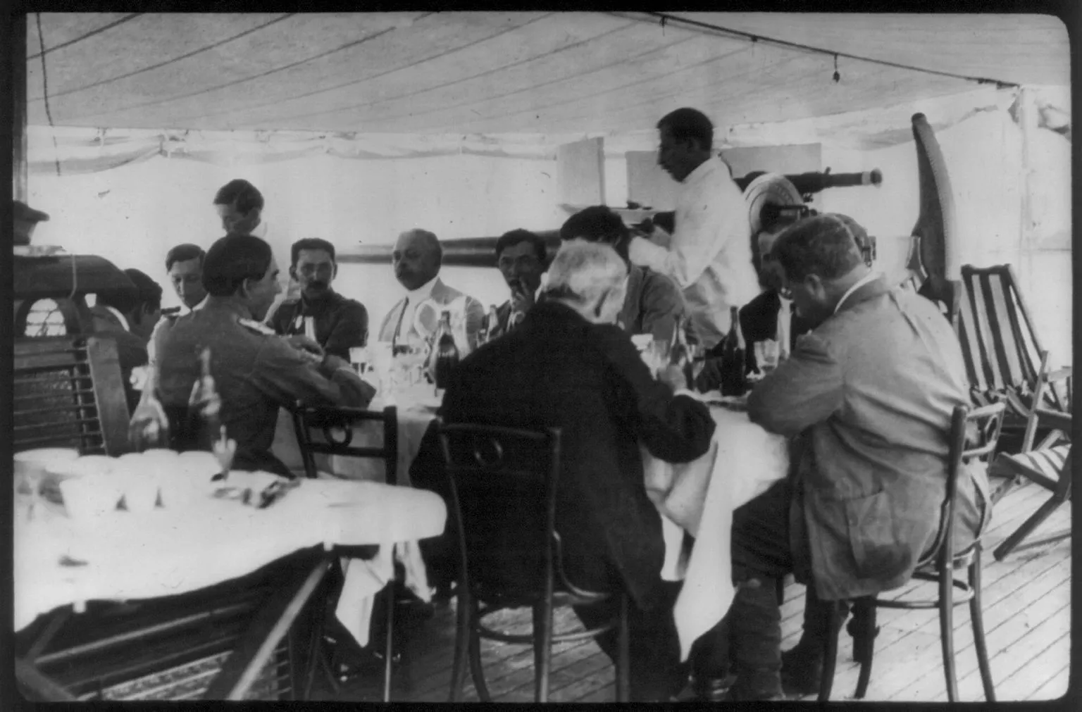 Members of the Roosevelt-Rondon expedition dining in a camp tent