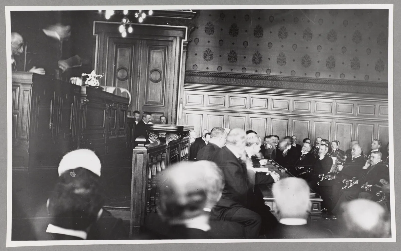 Theodore Roosevelt addressing a seated audience in an ornate hall at the Hotel de Ville in Paris, 1910